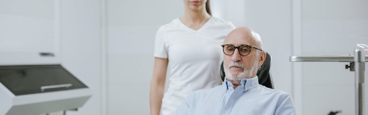 A doctor and senior patient in a modern medical clinic setting.